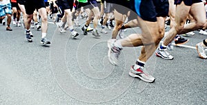 Marathon runners running on city street