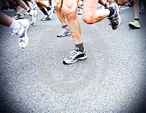 Marathon runners, running shoes motion blur