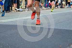 Marathon running race, many runners feet on road racing, sport competition, fitness healthy lifestyle concept