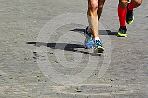 Marathon running race, people feet on city road