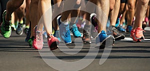 Marathon running race people feet on city road