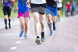 Marathon running race, people feet on city road