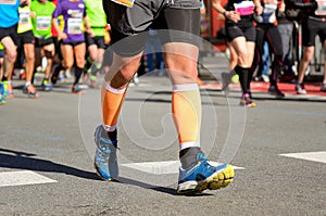 Marathon running race, people feet on road, sport concept