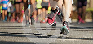 Marathon running race, runners feet on road