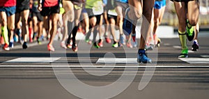 Marathon running race, runners feet on road