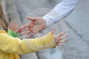 Marathon running race,runners support on road race, child`s hand giving highfive, kid supporting athletes who run