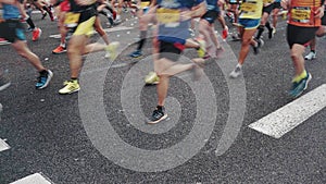 Marathon start finish line with confetti runners