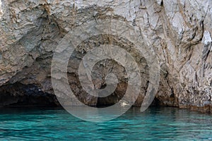 Marathonisi cave and beach on Turtle island Marathonisi, Greece, south of the island of Zakynthos, Greece.