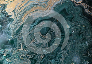 Marble abstract acrylic background. Blue and green marbling artwork texture. Golden glitter.