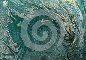 Marble abstract acrylic background. Blue and green marbling artwork texture. Golden glitter.