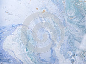 Marble abstract acrylic background. Blue marbling artwork texture. Golden glitter.