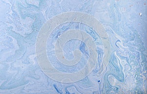 Marble abstract acrylic background. Blue marbling artwork texture. Golden glitter.