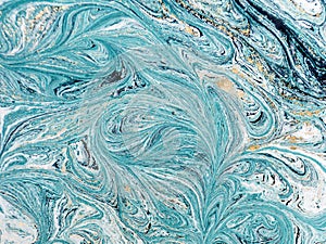 Marble abstract acrylic background. Blue marbling artwork texture. Golden glitter.