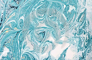 Marble abstract acrylic background. Blue marbling artwork texture. Golden glitter.