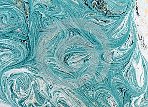 Marble abstract acrylic background. Blue marbling artwork texture. Golden glitter.