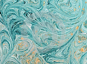 Marble abstract acrylic background. Blue marbling artwork texture. Golden glitter.