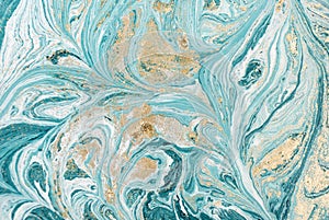 Marble abstract acrylic background. Blue marbling artwork texture. Golden glitter.