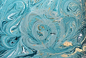 Marble abstract acrylic background. Blue marbling artwork texture. Golden glitter.