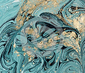 Marble abstract acrylic background. Blue marbling artwork texture. Golden glitter.