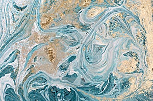 Marble abstract acrylic background. Blue marbling artwork texture. Golden glitter.