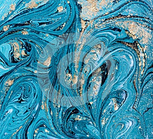 Marble abstract acrylic background. Blue marbling artwork texture. Golden glitter.