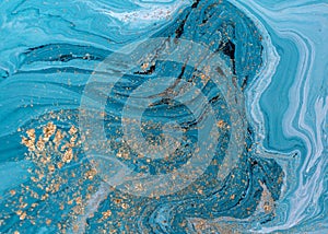 Marble abstract acrylic background. Blue marbling artwork texture. Golden glitter.