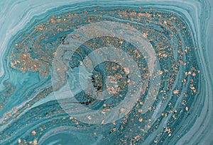 Marble abstract acrylic background. Blue marbling artwork texture. Golden glitter.