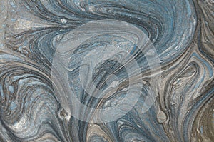 Marble abstract acrylic background. Blue marbling artwork texture. Golden glitter. Design, pale.