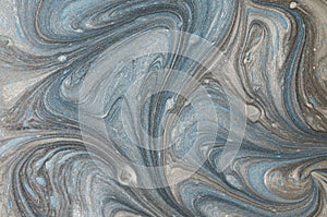 Marble abstract acrylic background. Blue marbling artwork texture. Golden glitter. Design, pale.