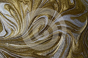 Marble abstract acrylic background. Blue marbling artwork texture. Golden glitter. Design, pale.