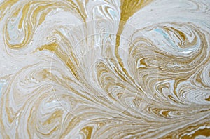 Marble abstract acrylic background. Blue marbling artwork texture. Golden glitter. Design, pale.