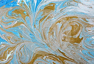 Marble abstract acrylic background. Blue marbling artwork texture. Golden glitter. Design, pale.