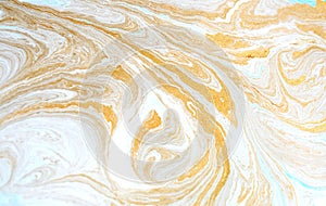 Marble abstract acrylic background. Blue marbling artwork texture. Golden glitter. Design, pale.