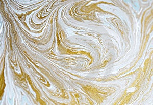 Marble abstract acrylic background. Blue marbling artwork texture. Golden glitter. Design, pale.