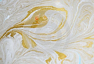 Marble abstract acrylic background. Blue marbling artwork texture. Golden glitter. Design, pale.