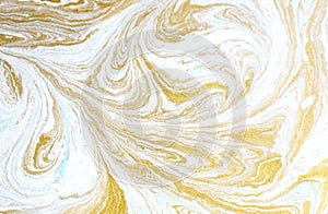 Marble abstract acrylic background. Blue marbling artwork texture. Golden glitter. Design, pale.