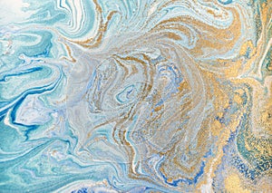 Marble abstract acrylic background. Blue marbling artwork texture. Golden glitter. photo