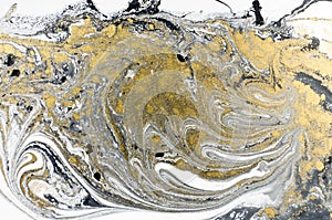 Marble abstract acrylic background. Nature black marbling artwork texture. Golden glitter.