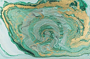 Marble abstract acrylic background. Nature green marbling artwork texture. Golden glitter.