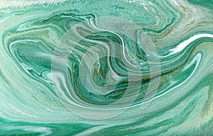 Marble abstract acrylic background. Nature green marbling artwork texture. Golden glitter.