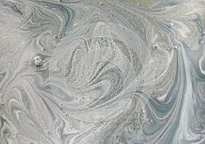 Marble abstract acrylic background. Nature marbling artwork texture. Golden glitter.