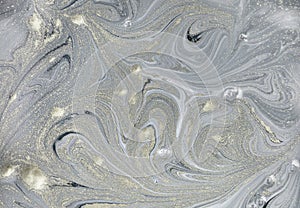 Marble abstract acrylic background. Nature marbling artwork texture. Golden glitter.