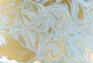 Marble abstract acrylic background. Nature marbling artwork texture. Golden glitter.