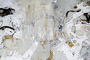Marble background texture with gold, black, grey and white colors, using acrylic pouring medium art technique. Useful as a backdro