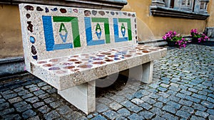 A marble bench with semi-precious stones