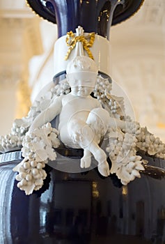 Marble boy with hooves on the ancient vase