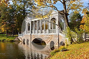 Marble bridge in autumn foliage in Catherine park, Pushkin (Tsarskoe Selo), Saint Petersburg, Russia