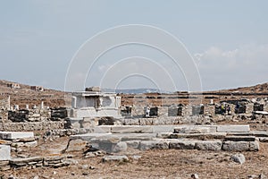 Marble bulls head on reconstructed section of the entablature, Stoa of Antigonos, Delos, Greece photo