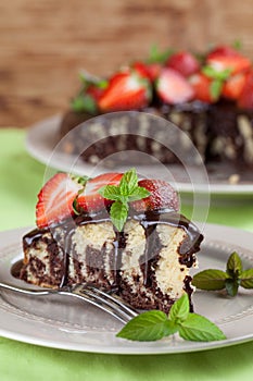 Marble cake with chocolate glaze and strawberries