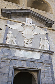 Marble call of arms and inscription